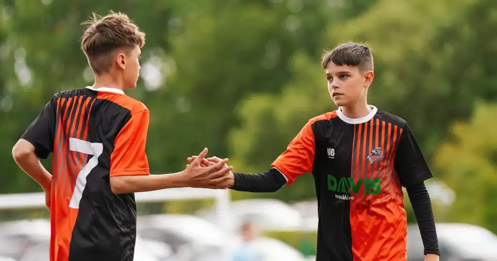 Football players shaking hands