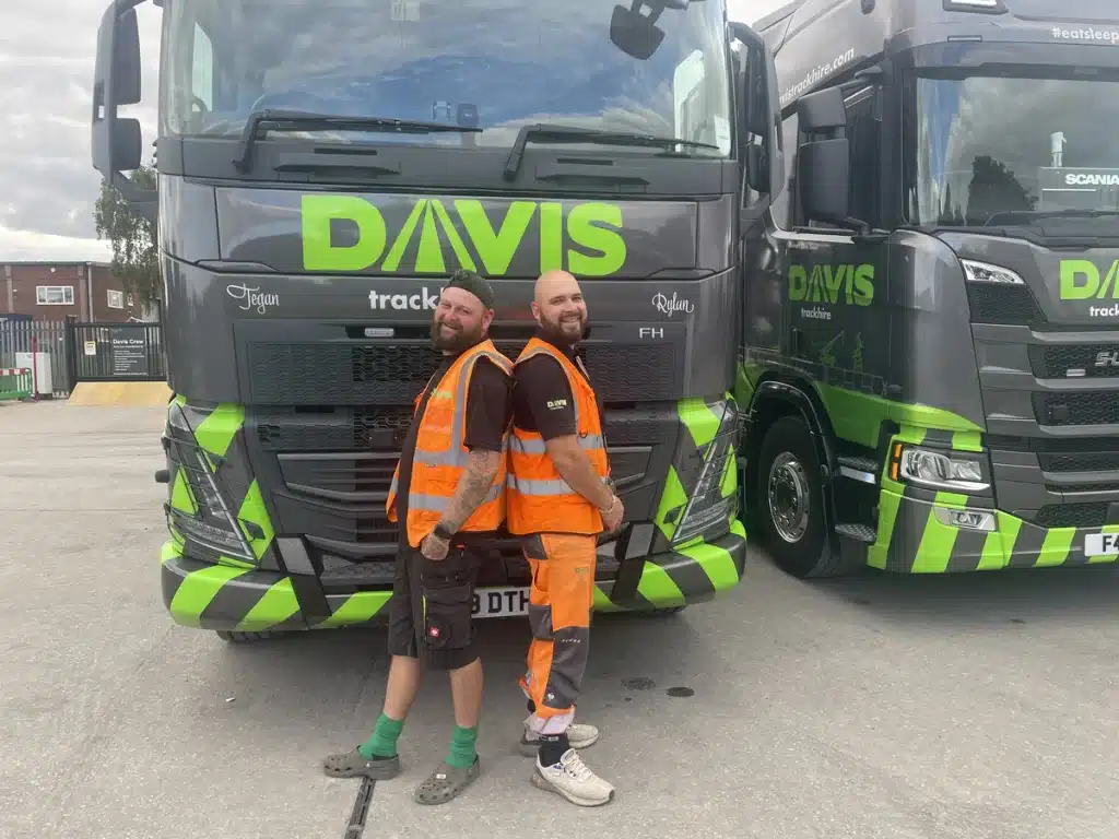 Jason and craig in front of davis trackhire truck